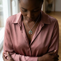 Thumbnail for Woman wearing the silver round photo necklace with her mother's photo | SKU: TPH-RNDN-SILVER