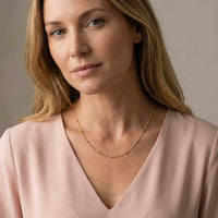 Thumbnail for Julia Beaded Chain Necklace by Brother & Sisters, featuring a delicate gold bead chain elegantly worn.