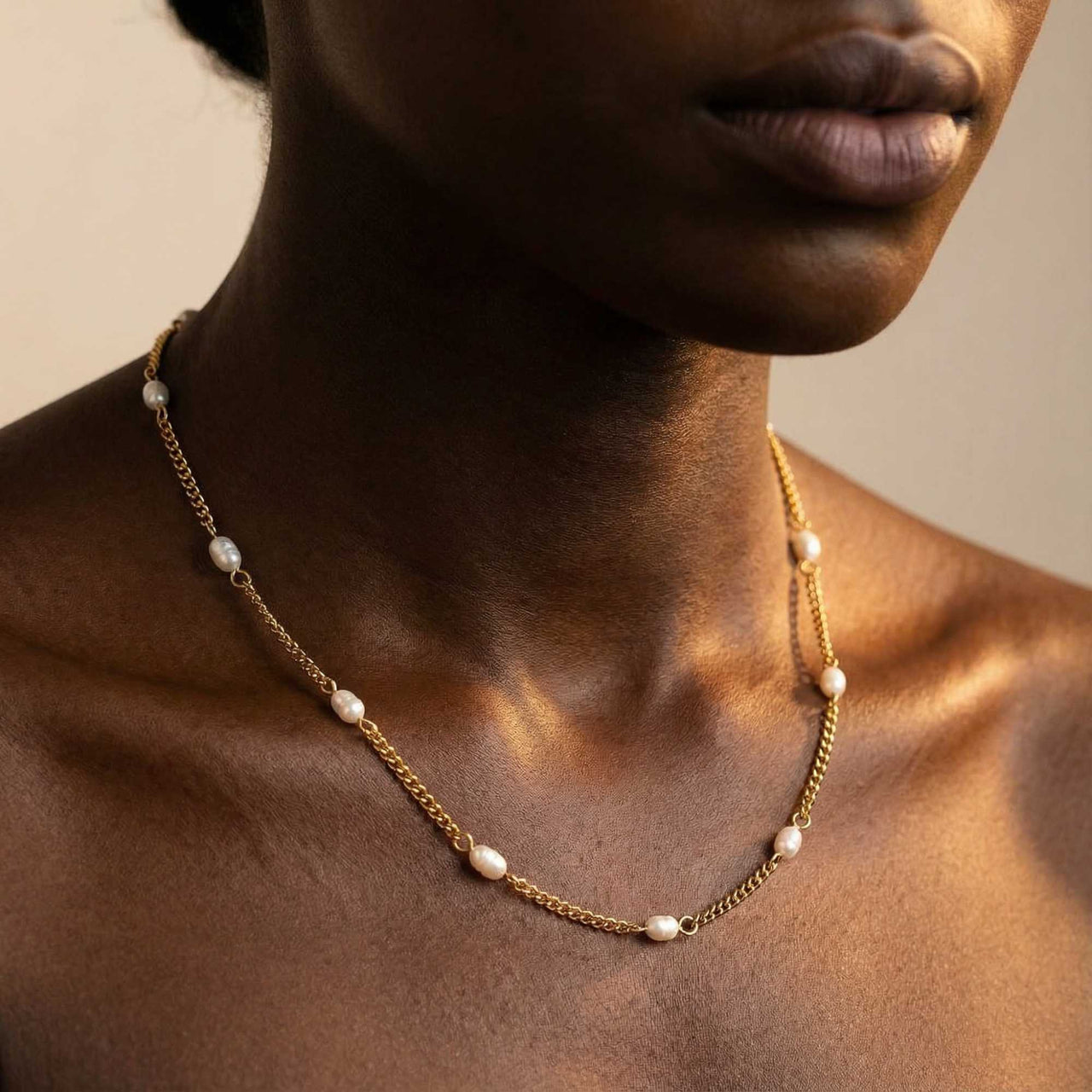 Dainty Pearl Choker on a model, featuring tiny freshwater pearls on a delicate gold chain by Brother & Sisters.