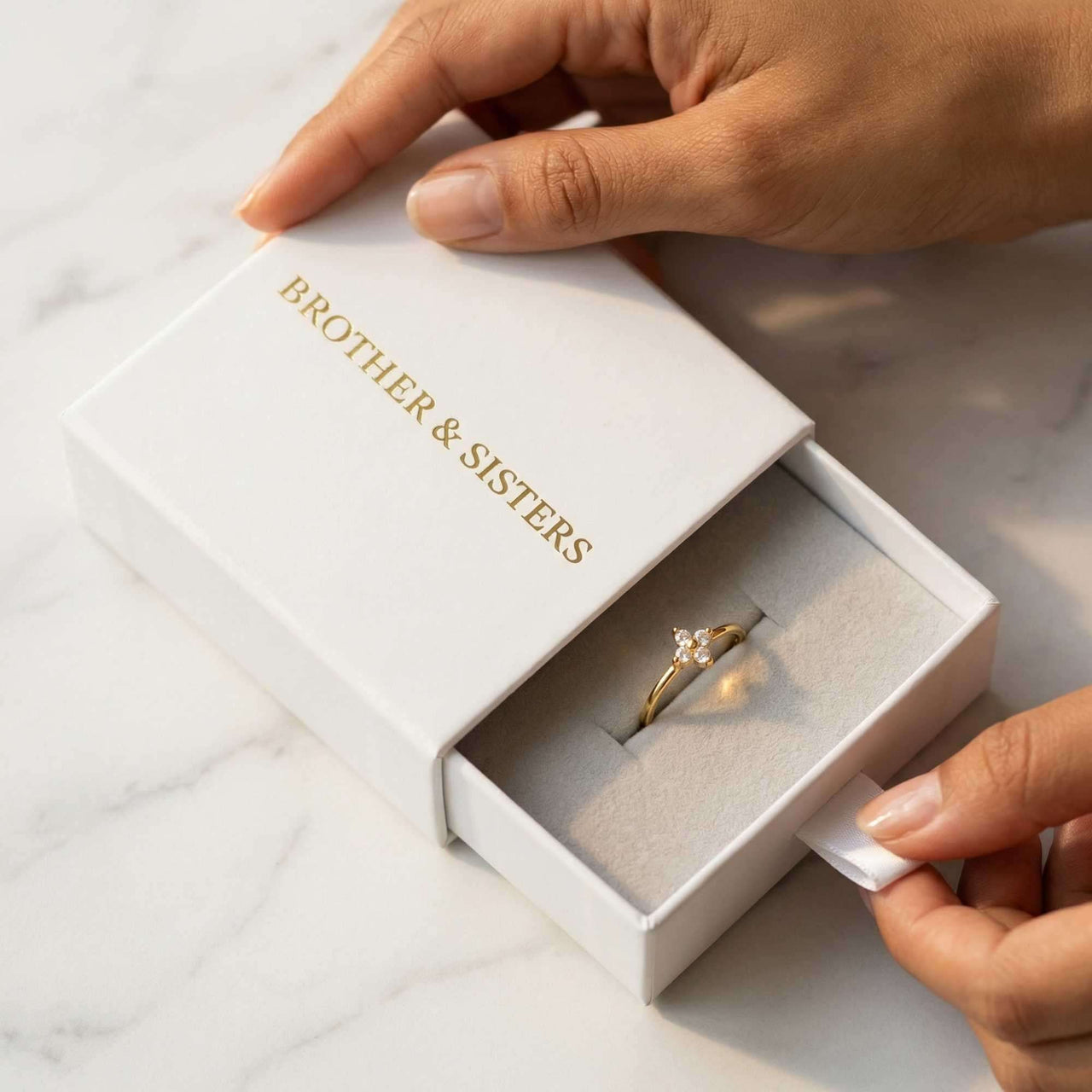 Crystal Flower Ring in a Brother & Sisters gift box, showcasing its delicate design and sparkling zirconia stones.