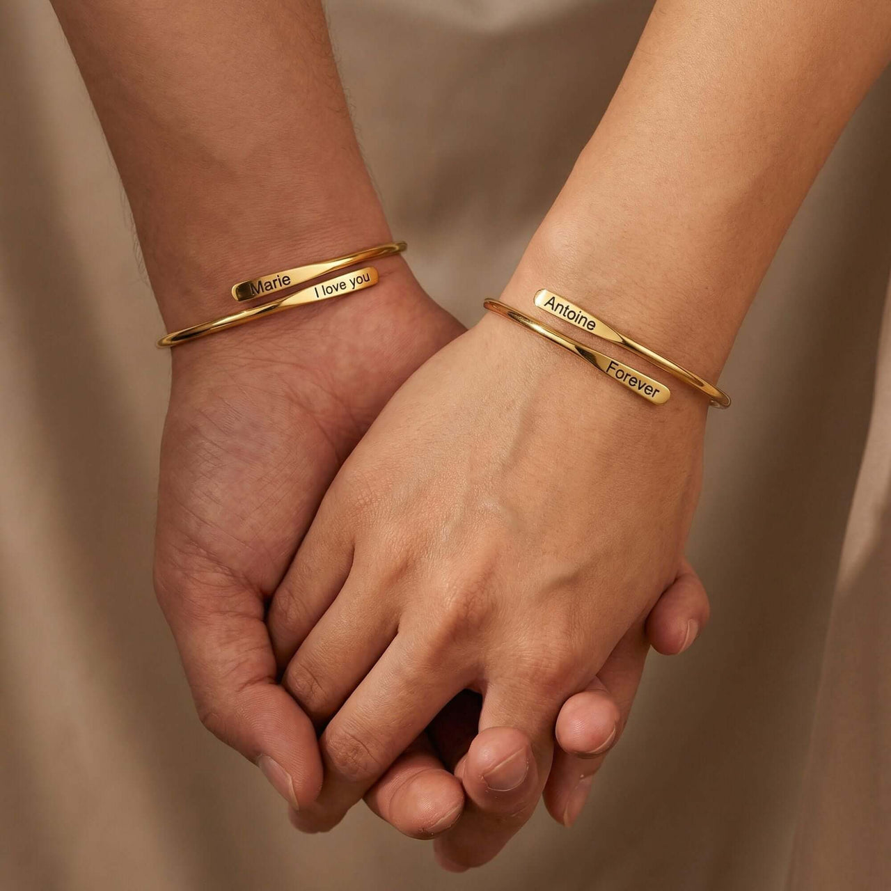 Wrap Couple Bracelet featuring two personalized cuffs from Brother & Sisters with engraved names and heartfelt messages.