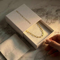 Thumbnail for Ria Paperclip Chain Necklace in a Brother & Sisters gift box, showcasing bold links and stylish design.