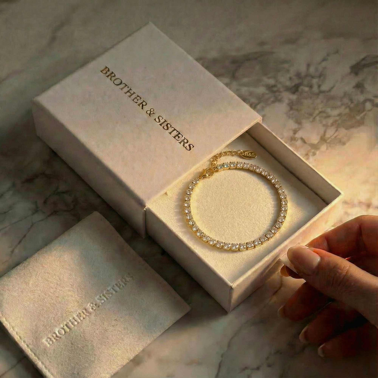 Tennis Bracelet by Brother & Sisters, elegantly presented in a box with sparkling zirconia for everyday wear.
