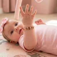 Thumbnail for Infant Bracelet on baby with name, personalized keepsake by Brother & Sisters, charm and elegance for little ones.