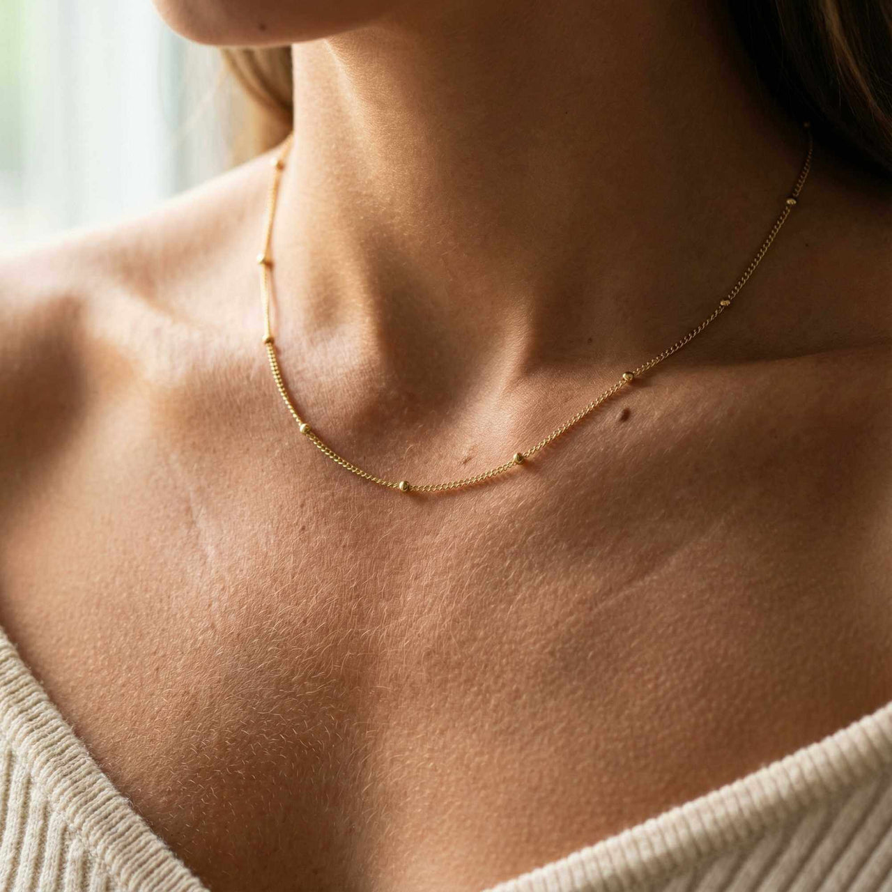 Julia Beaded Chain Necklace by Brother & Sisters features a delicate gold chain with tiny beads.