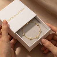 Thumbnail for Crystal Flower Bracelet in elegant gift box by Brother & Sisters, showcasing delicate crystal flowers on chain.