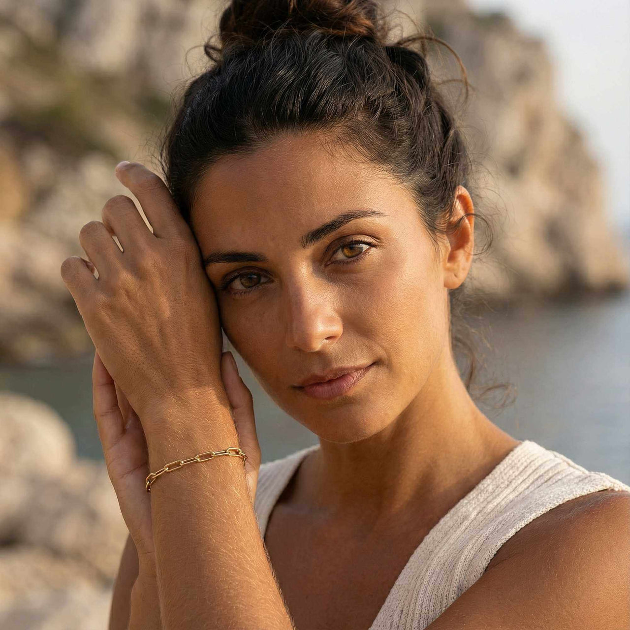 Model wearing a Paperclip Chain Bracelet by Brother & Sisters, showcasing its premium stainless steel and 18K gold PVD finish.