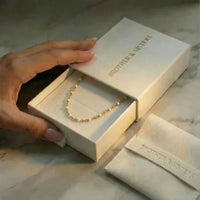 Thumbnail for White Beaded Choker in a Brother & Sisters gift box, showcasing delicate design and gold accents.