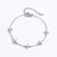 Thumbnail for Crystal Flower Bracelet by Brother & Sisters featuring five sparkling four-leaf crystal flowers on a fine chain.