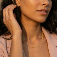 Thumbnail for Julia Beaded Chain Necklace featuring tiny golden beads by Brother & Sisters, showcasing understated elegance.