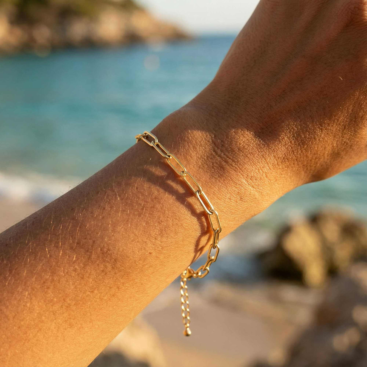 Freshwater Pearl Bracelet on a wrist, featuring unique pearls and a golden-hour beach backdrop by Brother & Sisters.