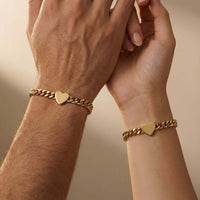 Thumbnail for Love Couple Bracelet featuring matching gold Cuban link chains with heart pendants by Brother & Sisters.
