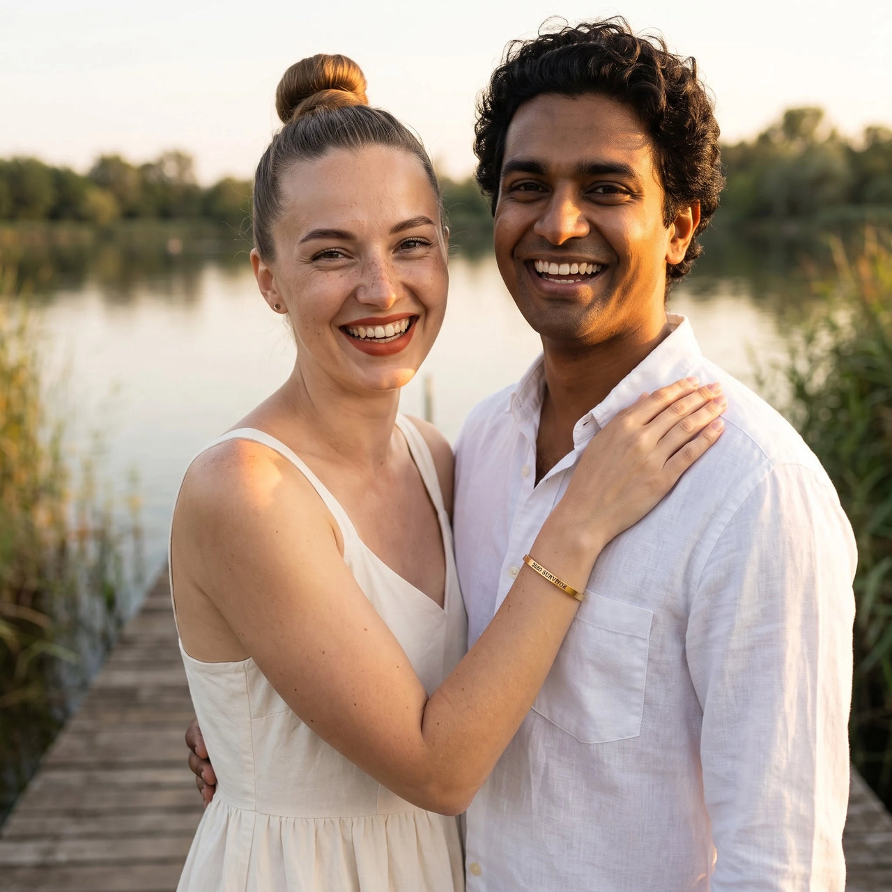 Couple moment, she wears the 2020 Survivor bracelet in gold | SKU: 2020s-g