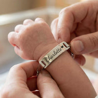Thumbnail for Infant Bracelet from Brother & Sisters on a baby's wrist, personalized with the name Charlotte.