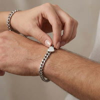 Thumbnail for Love Couple Bracelet with polished heart on Cuban link chain by Brother & Sisters, symbolizing connection between couples.
