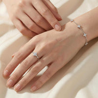 Thumbnail for Crystal Flower Ring worn on a hand, featuring zirconia stones and delicate silver design by Brother & Sisters.