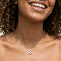 Thumbnail for Crystal Flower necklace worn by model showcasing refined dainty four-leaf zircon pendant signature design