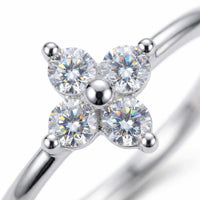 Thumbnail for Crystal Flower Ring by Brother & Sisters featuring a delicate four-leaf design with brilliant-cut zirconia stones.