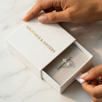 Thumbnail for Crystal Flower Ring in a Brother & Sisters gift box, showcasing its delicate design and sparkle.