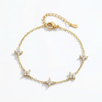 Thumbnail for Crystal Flower Bracelet by Brother & Sisters featuring five sparkling crystal flowers on a delicate gold chain.