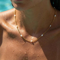 Thumbnail for Dainty Pearl Choker worn by a woman, featuring tiny freshwater pearls and a delicate gold chain by Brother & Sisters.