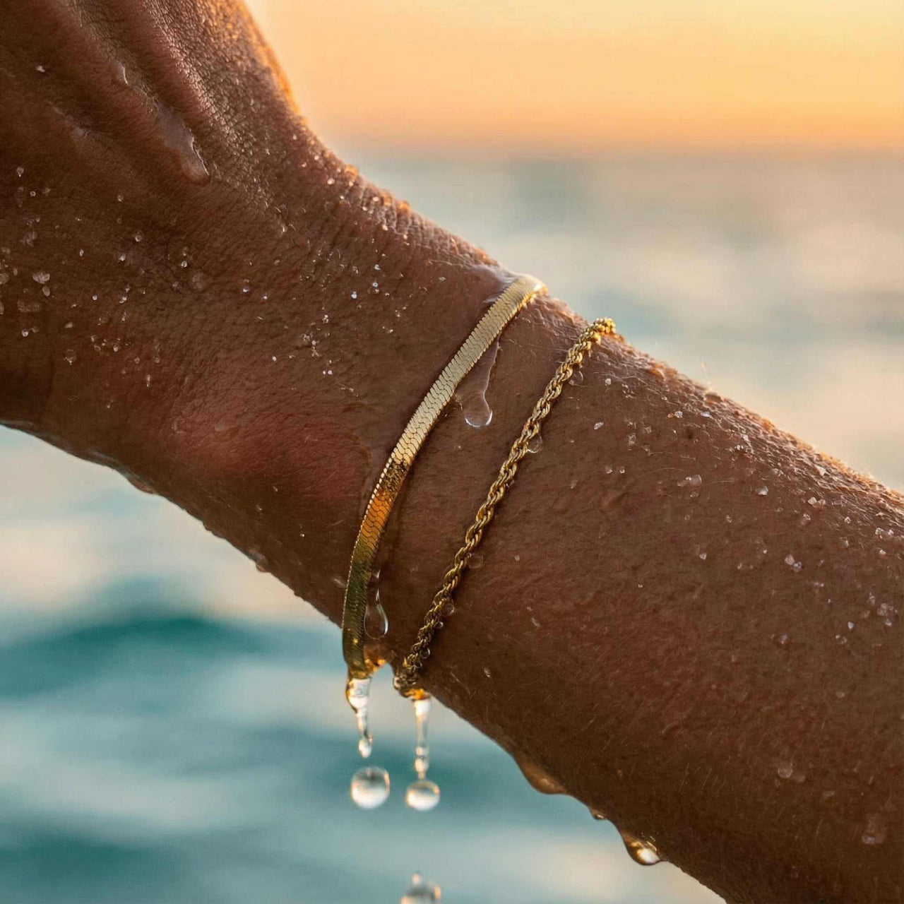 Ios Layered Bracelet by Brother & Sisters, featuring a gold herringbone chain and twisted rope, perfect for outdoor activities.