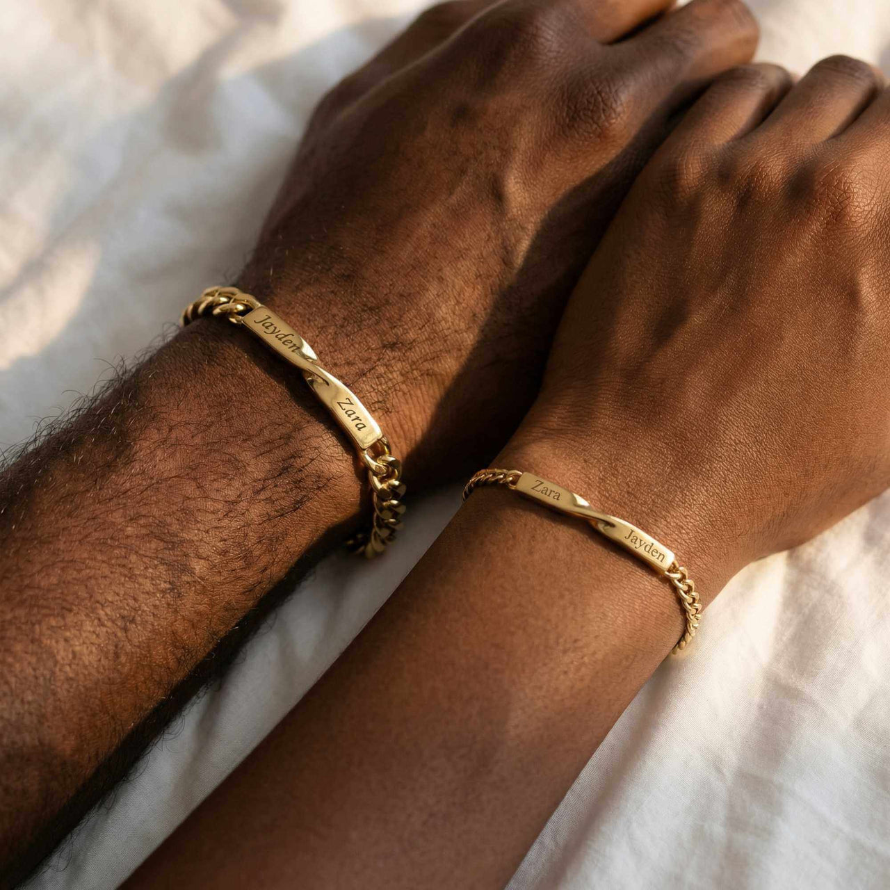 Infinity Bond Matching Bracelet by Brother & Sisters featuring two name-engraved twisted bars in gold.