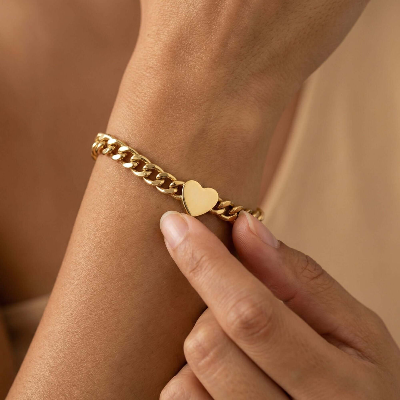 Love Couple Bracelet featuring a polished heart on a Cuban link chain by Brother & Sisters.