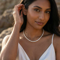 Thumbnail for Isolde Tennis Necklace worn by a woman, featuring brilliant-cut diamond simulants set in 18K gold by Brother & Sisters.