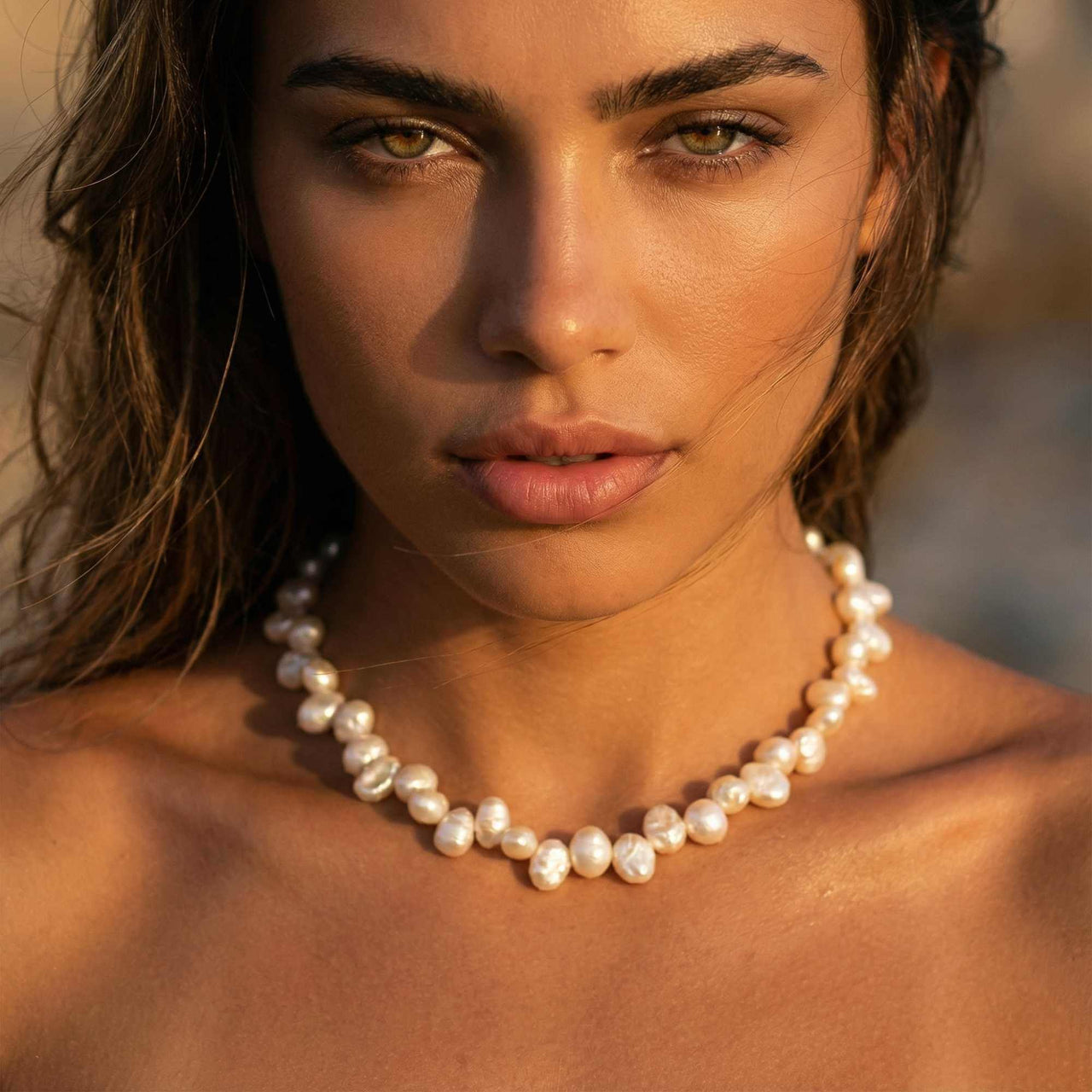 Sunseeker Pearl Choker featuring unique baroque pearls on a golden chain by Brother & Sisters.