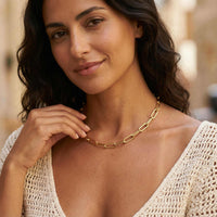 Thumbnail for Ria Paperclip Chain Necklace worn by a woman, featuring bold oversized links in gold from Brother & Sisters.