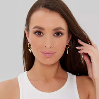 Thumbnail for Amora Heart Drops gold earrings worn by a model, featuring heart-shaped charm and chic hoop, by Brother & Sisters.