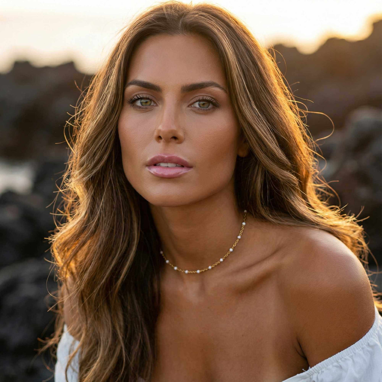 White Beaded Choker by Brother & Sisters worn by a model with long wavy hair, showcasing its delicate design.