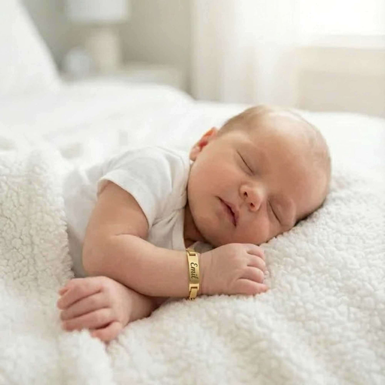 Infant Bracelet on sleeping baby by Brother & Sisters, showcasing personalized charm and elegance.