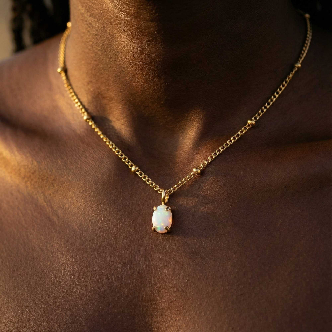 Opal Pendant Necklace by Brother & Sisters featuring a AAA-grade opal set in gold on a delicate chain.
