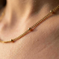 Thumbnail for Julia Beaded Chain Necklace featuring a delicate chain with tiny golden beads by Brother & Sisters.