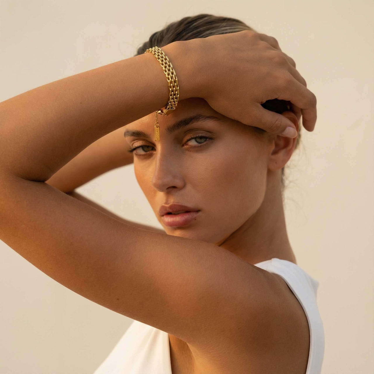 Sifnos Woven Bracelet worn by model, showcasing intricate interlocking links and 18K gold PVD finish by Brother & Sisters.