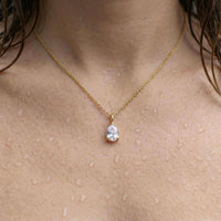 Thumbnail for Astra Teardrop Necklace by Brother & Sisters featuring a shimmering teardrop-cut white stone on a delicate chain.