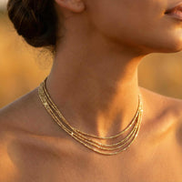 Thumbnail for Riviera Layered Choker by Brother & Sisters showcases four delicate gold chains for an effortless layered look.