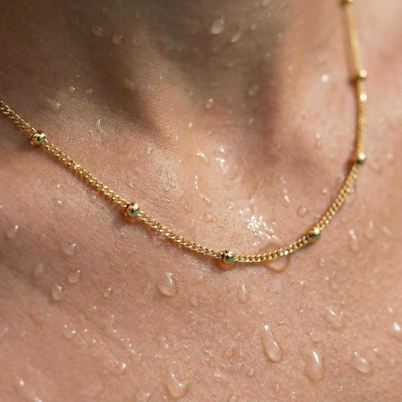Julia Beaded Chain Necklace with tiny golden beads, showcasing its elegance and shine. By Brother & Sisters.