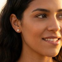 Thumbnail for Crystal Flower Stud Earrings worn by a woman, featuring four-leaf crystal design by Brother & Sisters, adding subtle sparkle.