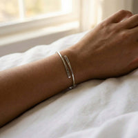 Thumbnail for Wrap Couple Bracelet by Brother & Sisters worn on wrist, featuring custom engravings for couples.