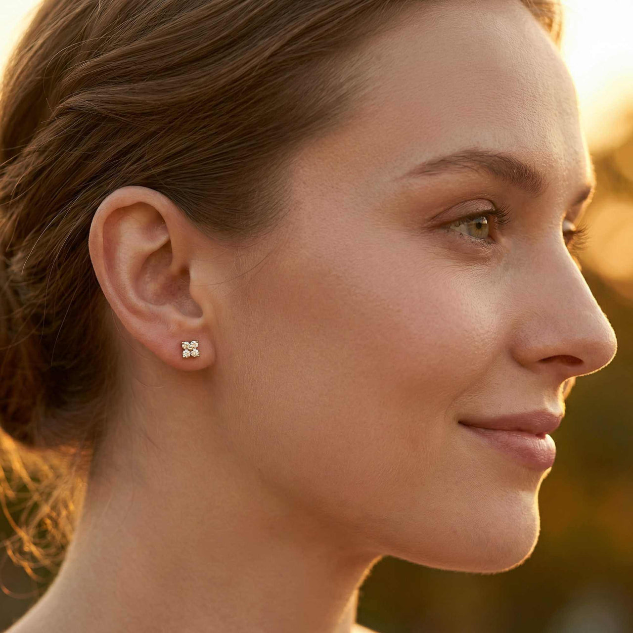 Crystal Flower Stud Earrings by Brother & Sisters, showcasing tiny four-leaf flowers with zirconia sparkle.