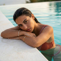 Thumbnail for Model wearing a Tennis Bracelet by Brother & Sisters, relaxing by the pool in a swimsuit.
