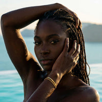 Thumbnail for Ios Layered Bracelet worn by a model with braided hair by Brother & Sisters, highlighting its effortless outdoor style.