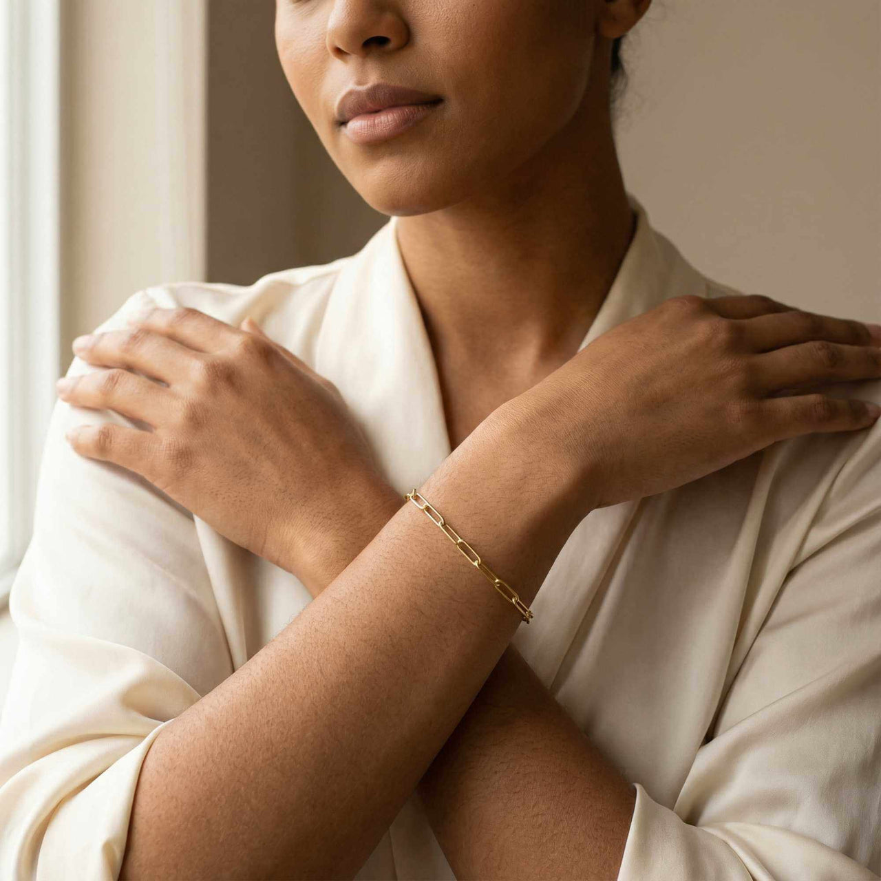 Model wearing Paperclip Chain Bracelet by Brother & Sisters, showcasing its simple links and elegant style.