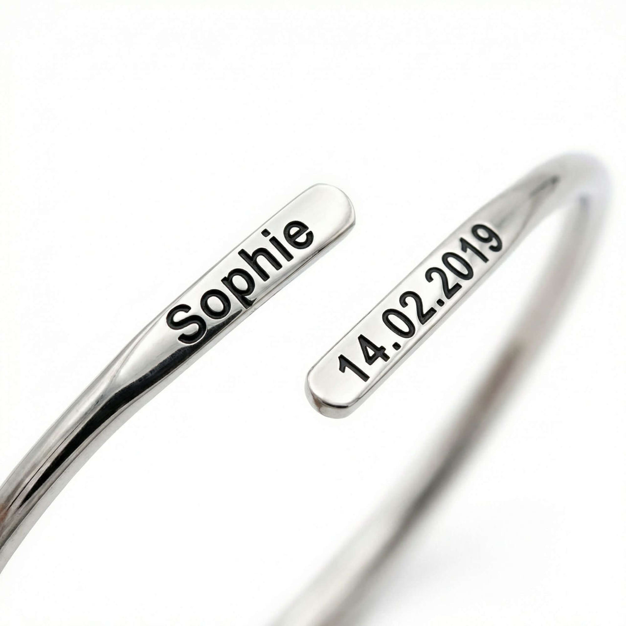 Wrap Couple Bracelet featuring custom engravings, his name and anniversary date, by Brother & Sisters.