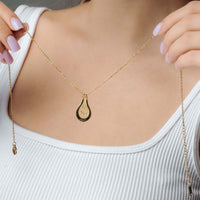 Thumbnail for Birth Flower Name Necklace featuring a gold teardrop pendant worn by a model showcasing personalized elegance by Brother & Sisters.