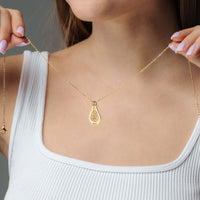 Thumbnail for Woman wearing Birth Flower Name Necklace by Brother & Sisters, showcasing personal elegance and style.