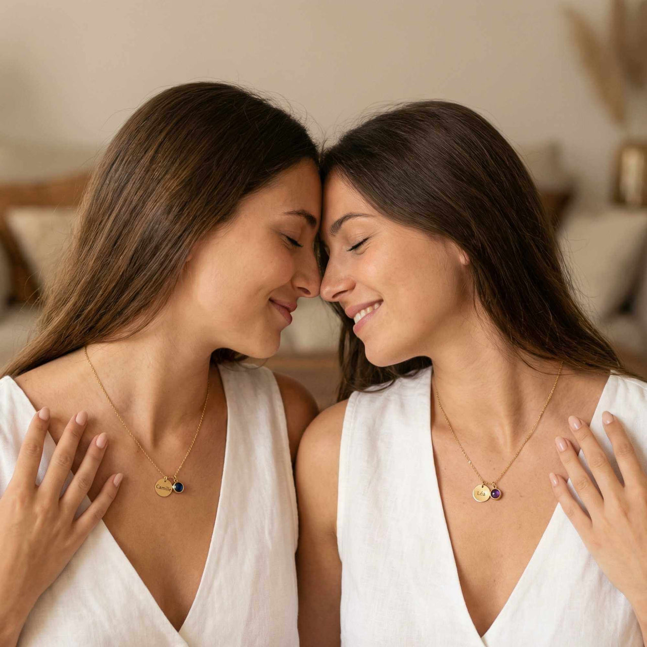 Precious Name Necklace worn by two women, showcasing personalized engravings and matching birthstone crystals by Brother & Sisters.